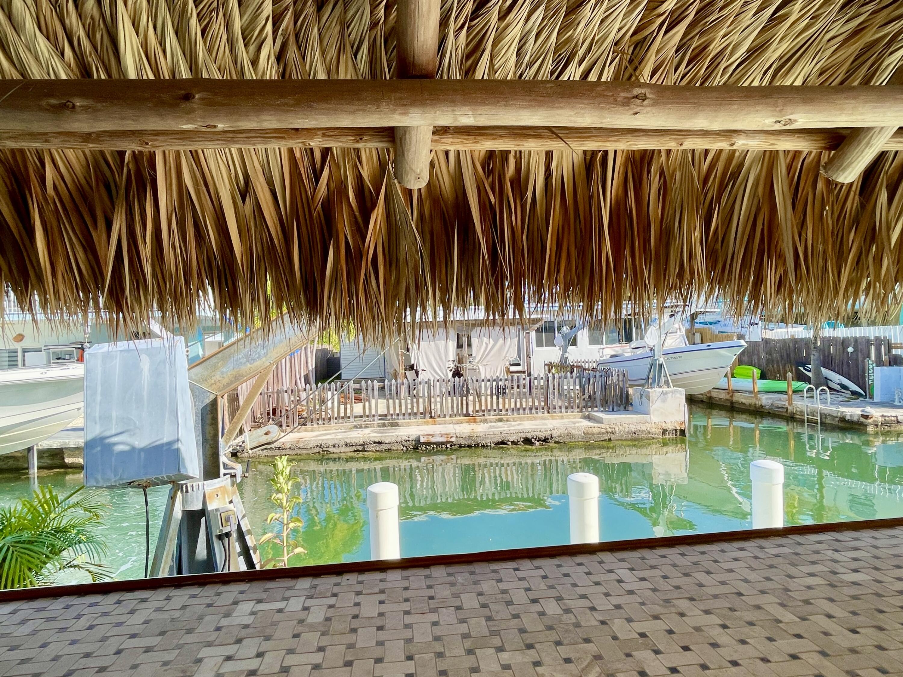 64 Seagate Boulevard Key Largo, FL 33037 - Photo 30 of 44 a view of swimming pool with a garden and trees