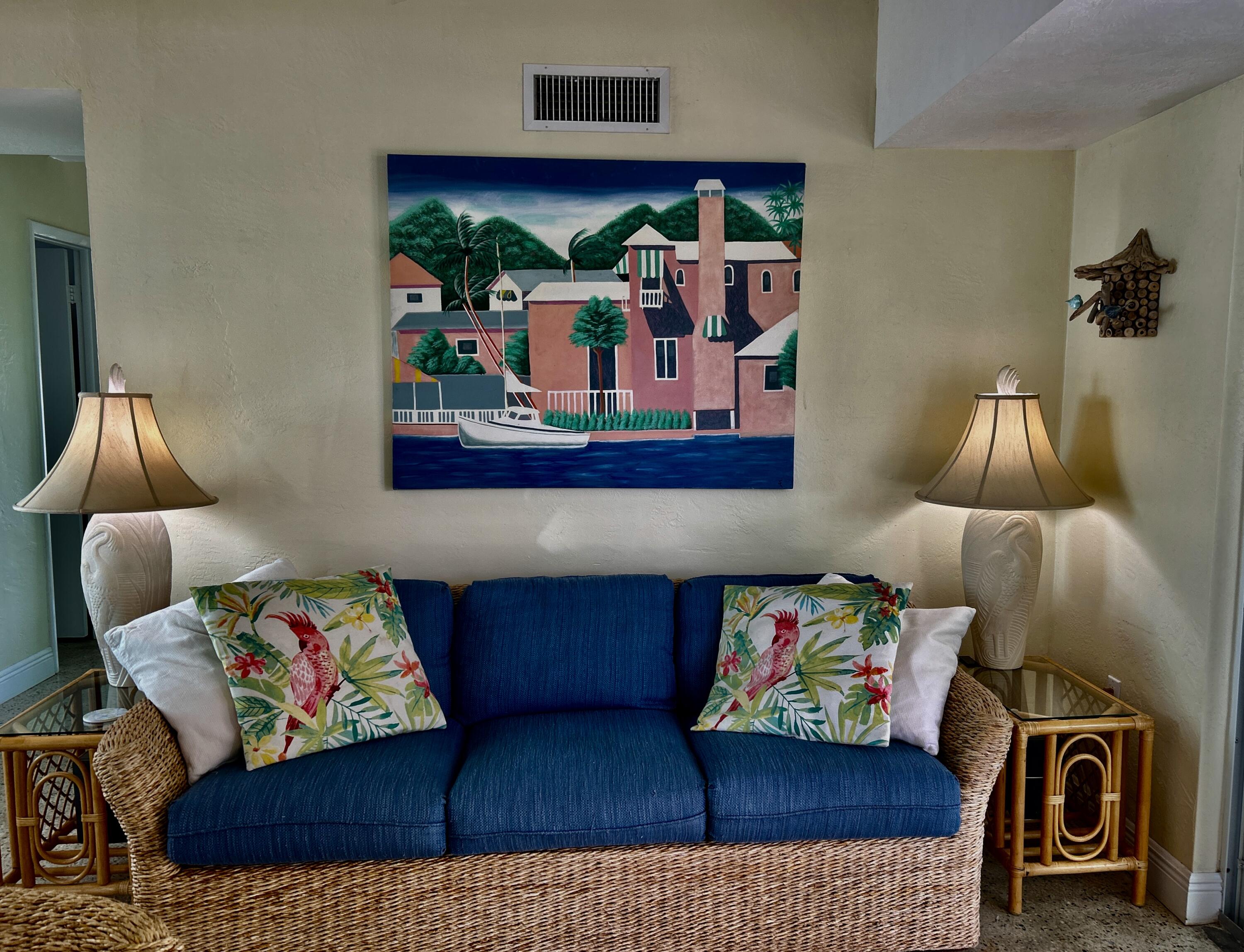 64 Seagate Boulevard Key Largo, FL 33037 - Photo 41 of 44 a living room with furniture and a painting on the wall
