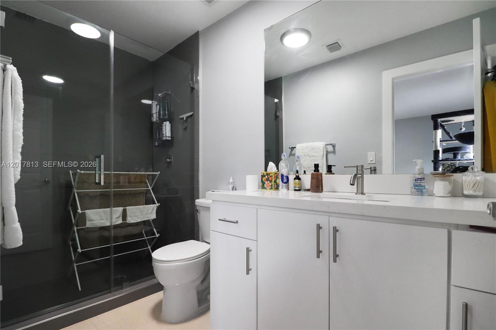 12535 Southwest 31st Terrace Miami, FL 33175 - Photo 20 of 32 a bathroom with a sink a toilet and a mirror