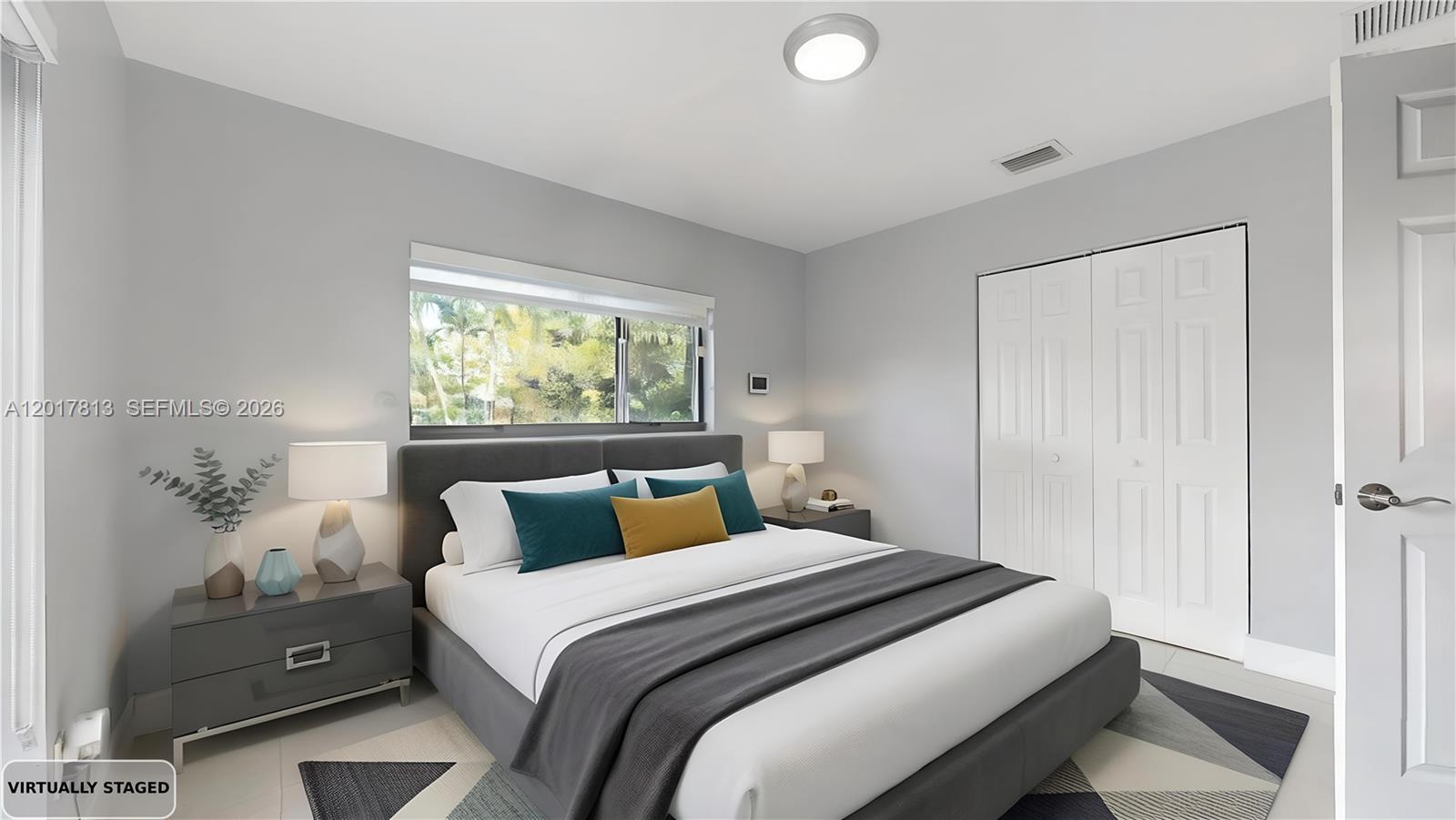12535 Southwest 31st Terrace Miami, FL 33175 - Photo 24 of 32 a bedroom with a bed and window