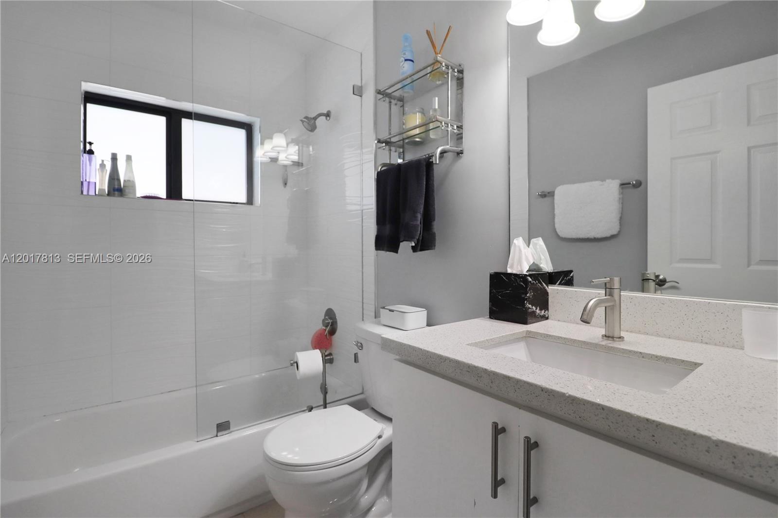 12535 Southwest 31st Terrace Miami, FL 33175 - Photo 26 of 32 a bathroom with a granite countertop sink toilet and shower
