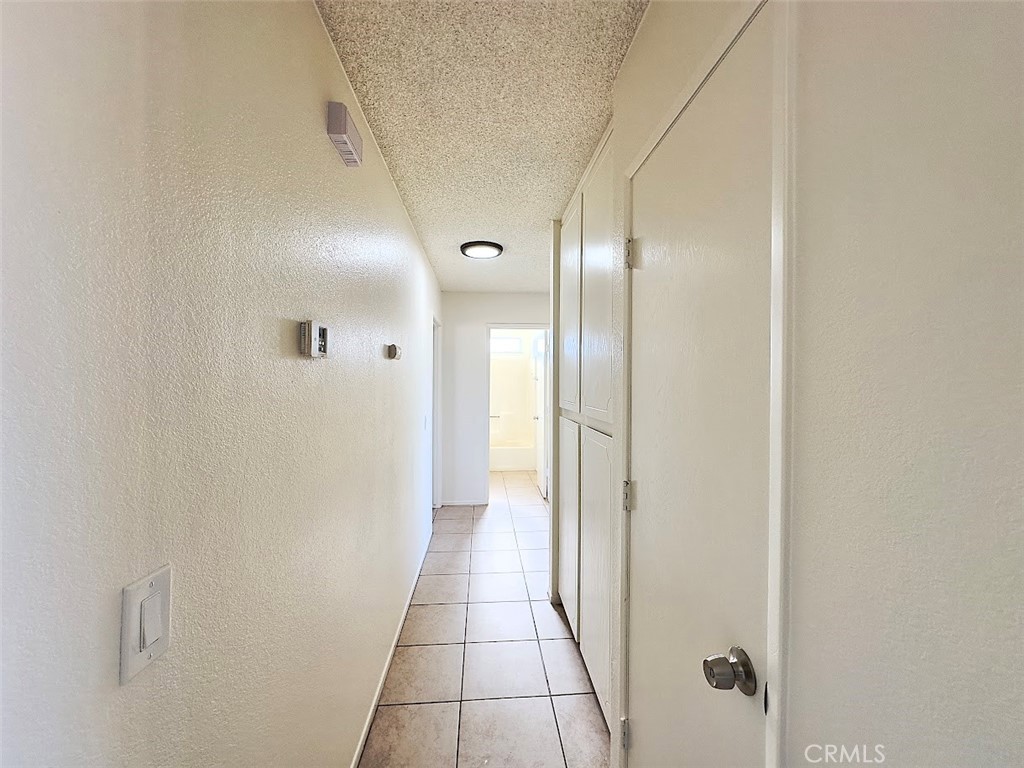 22311 Thunderbird Road Apple Valley, CA 92307 - Photo 12 of 18 a bathroom with a glass shower door