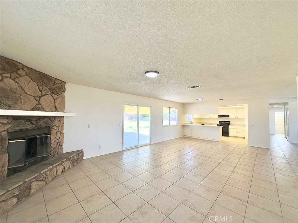 22311 Thunderbird Road Apple Valley, CA 92307 - Photo 6 of 18 a view of a livingroom with a fireplace