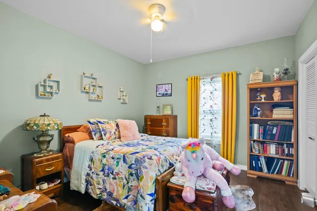 a bathroom with a toilet sink vanity tub and shower