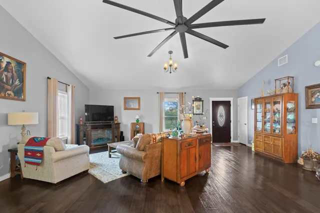 a kitchen with kitchen island granite countertop wooden cabinets and a stove