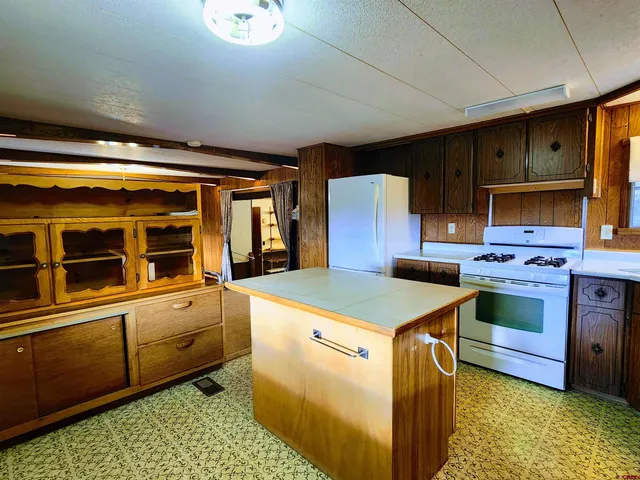 a kitchen that has a stove and a microwave