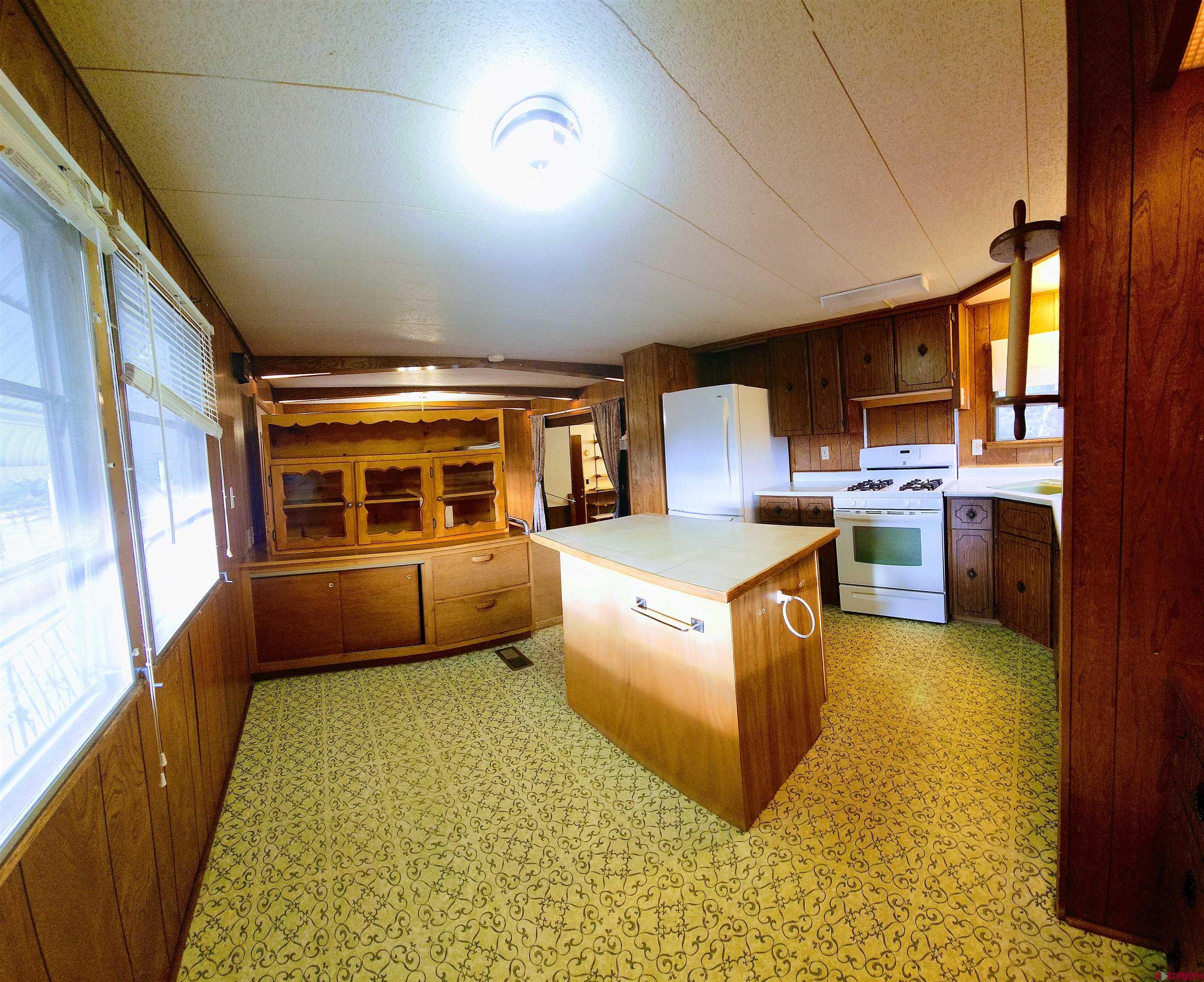 24593 Timothy Road Cedaredge, CO 81413 - Photo 20 of 33 a living room with furniture and a rug