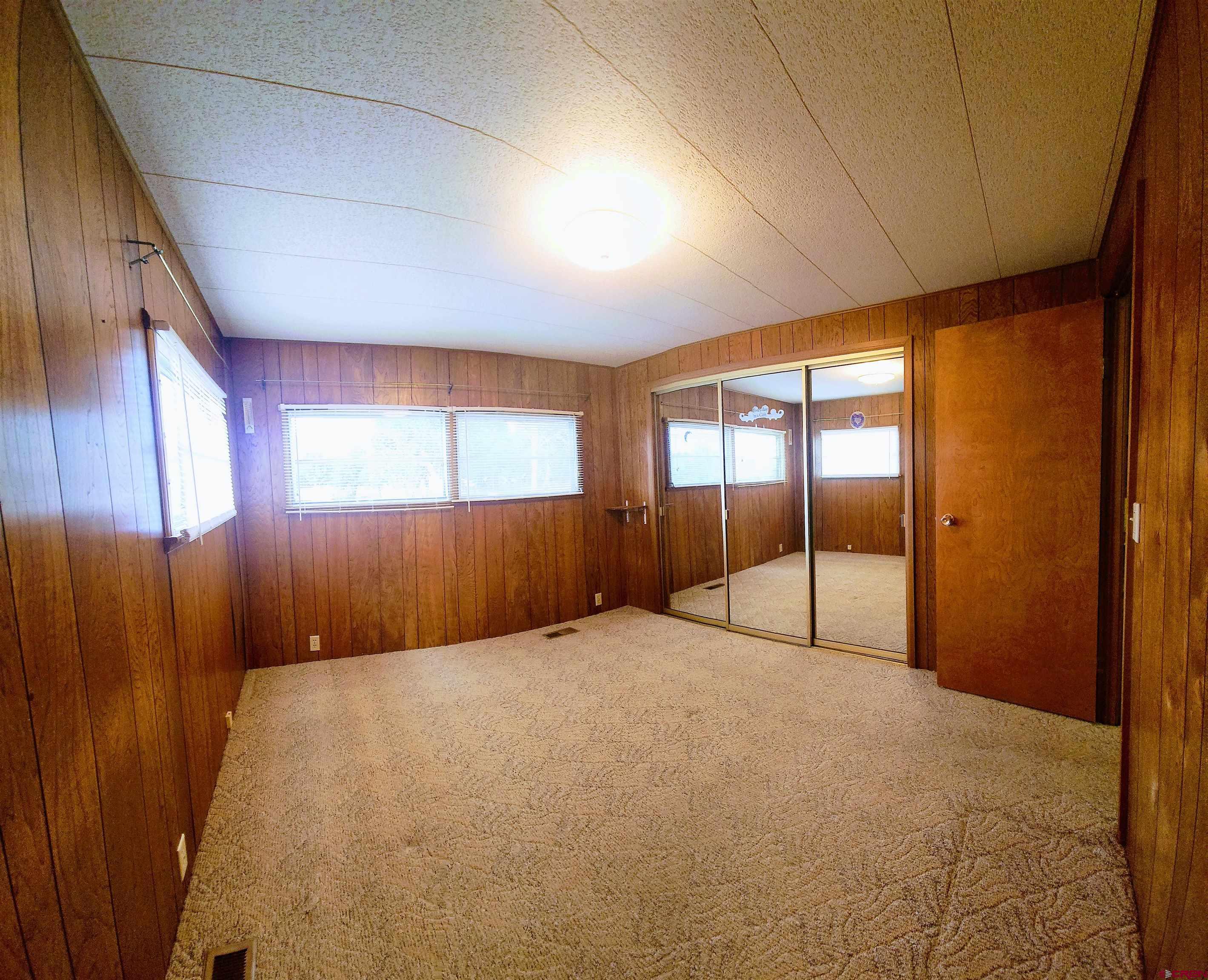 24593 Timothy Road Cedaredge, CO 81413 - Photo 24 of 33 a view of an empty room with a window