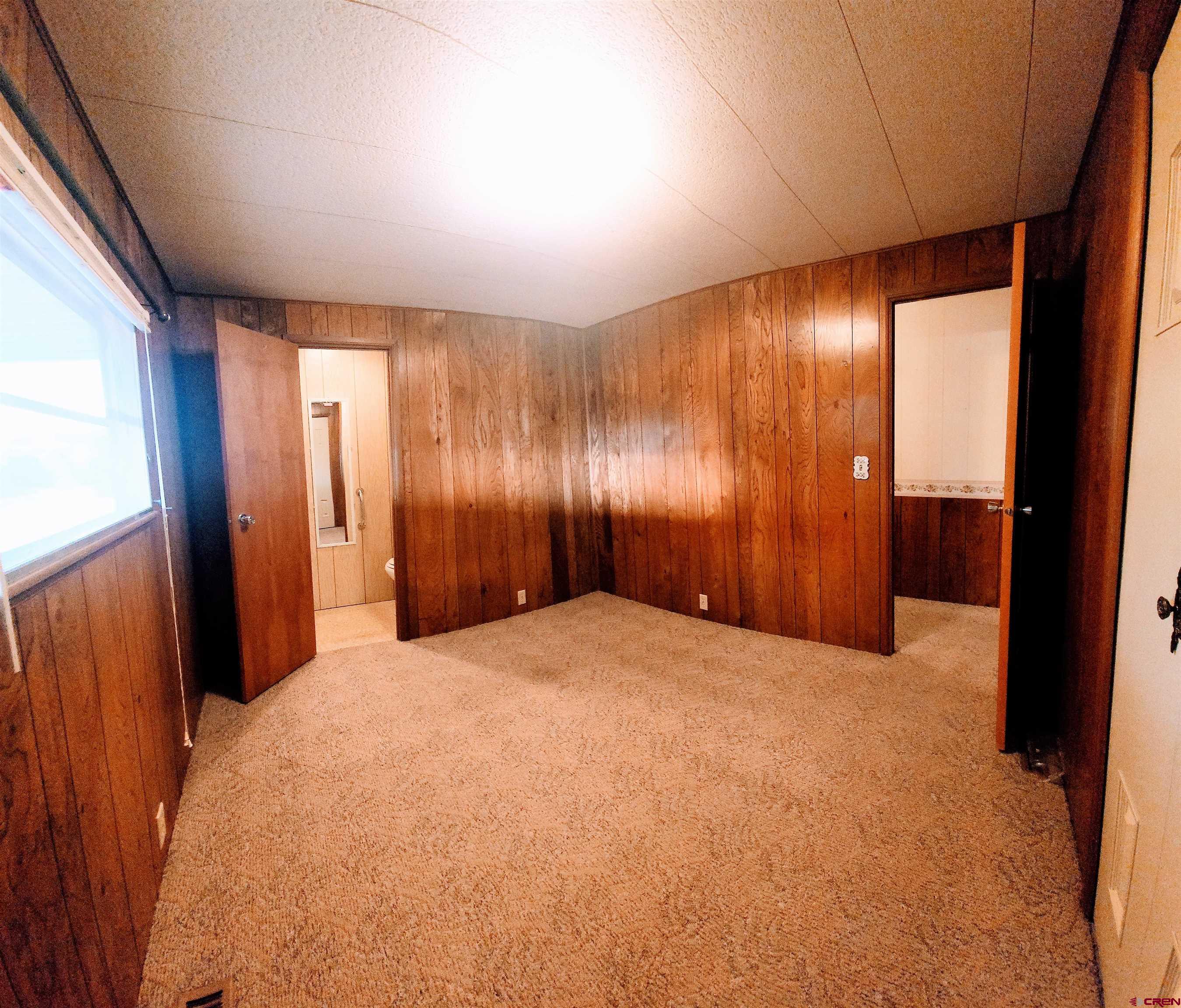24593 Timothy Road Cedaredge, CO 81413 - Photo 26 of 33 a view of an empty room with a window
