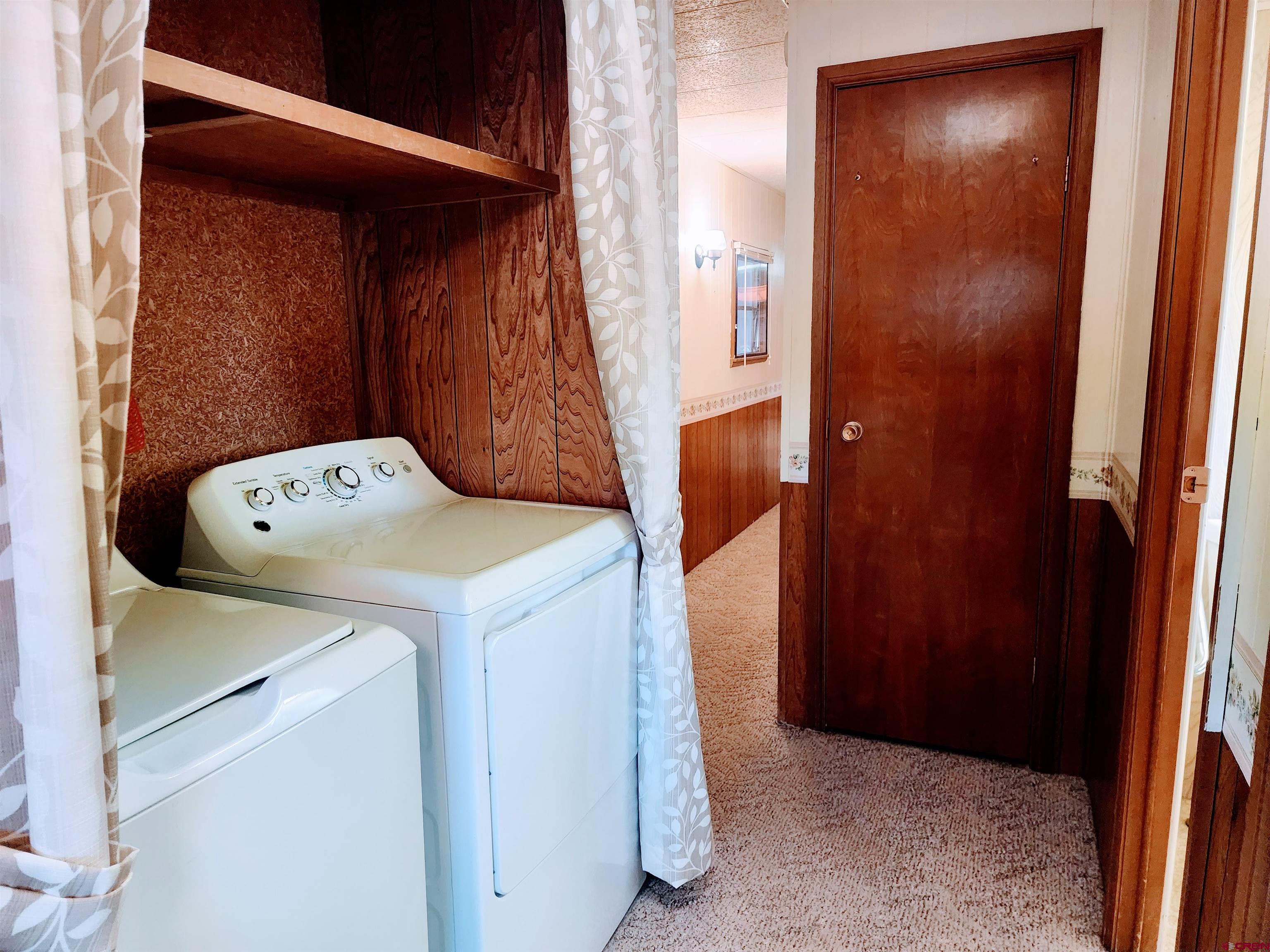 24593 Timothy Road Cedaredge, CO 81413 - Photo 28 of 33 a utility room with dryer and washer