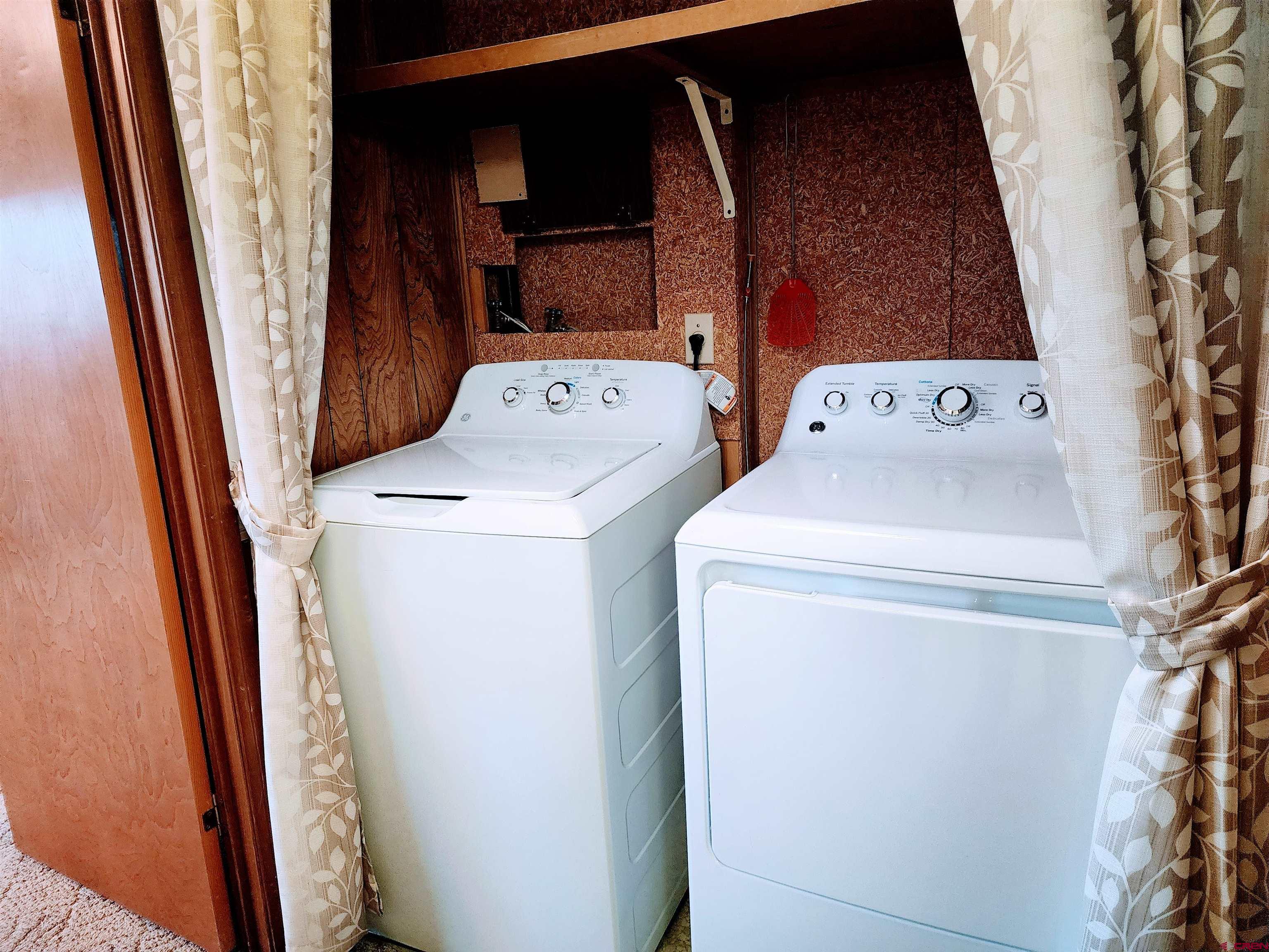 24593 Timothy Road Cedaredge, CO 81413 - Photo 29 of 33 a utility room with dryer and washer