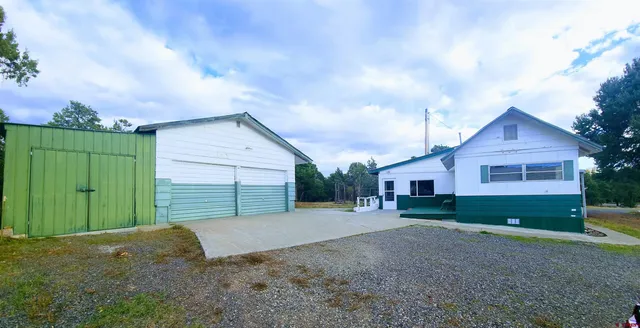 a view of a backyard of the house