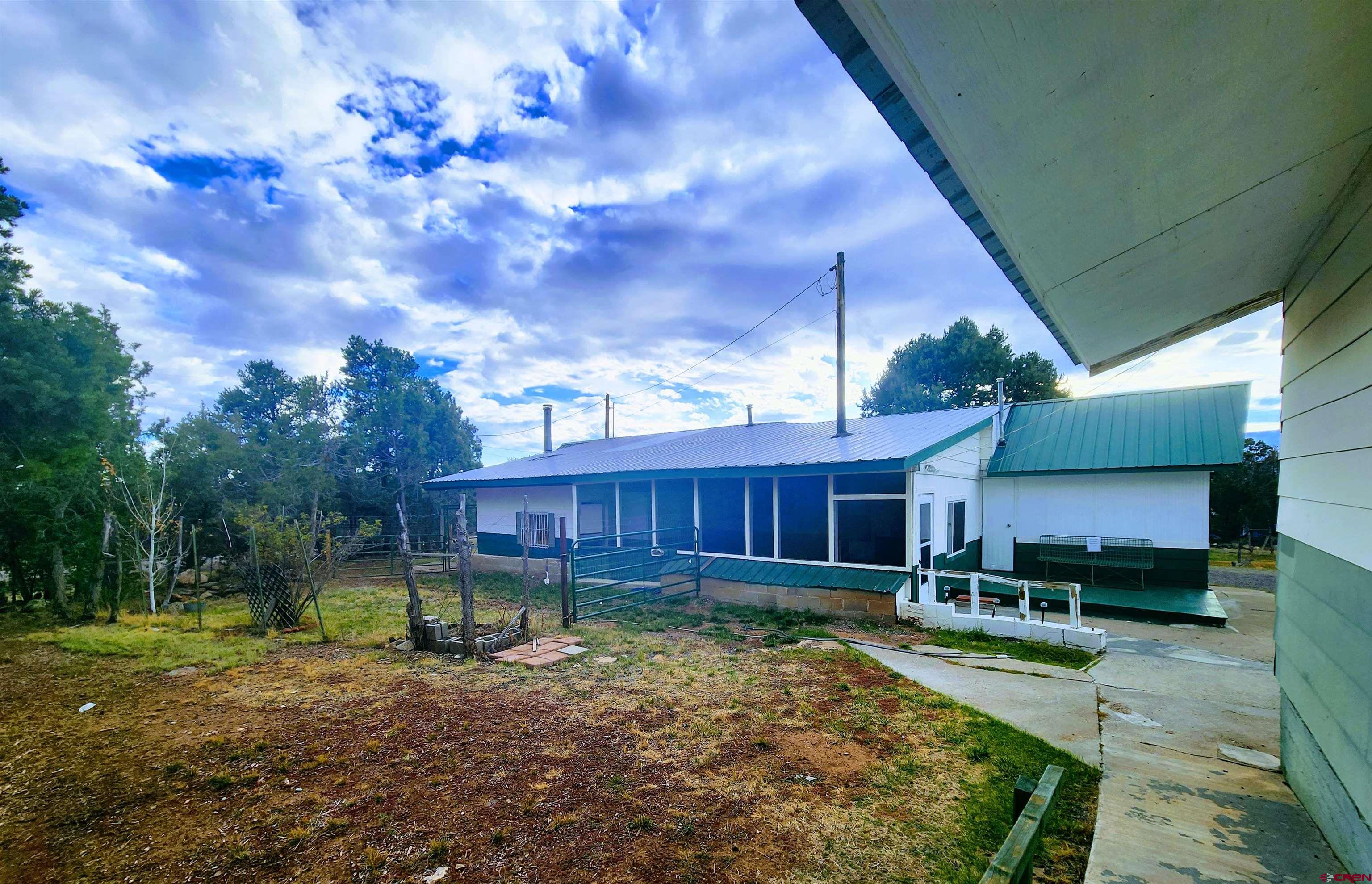 24593 Timothy Road Cedaredge, CO 81413 - Photo 9 of 33 a backyard of a house with a garden