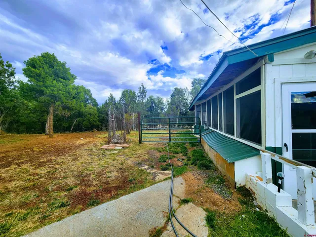 a backyard of a house with lots of green space