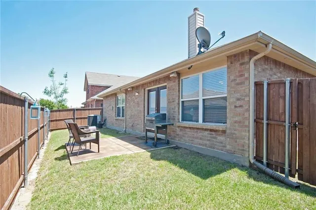 a front view of house with yard outdoor seating and garage