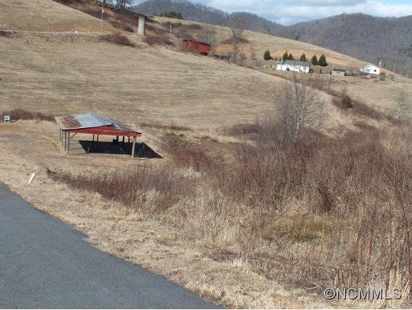 7 Gods Country Road, Unit 7 Waynesville, NC 28785 - Photo 1 of 20 a view of car yard and road