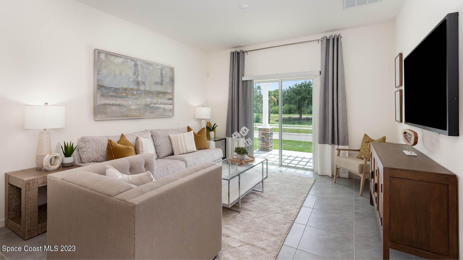 3336 Morrow Place Mims, FL 32754 - Photo 6 of 36 a room with a bed and a flat screen tv