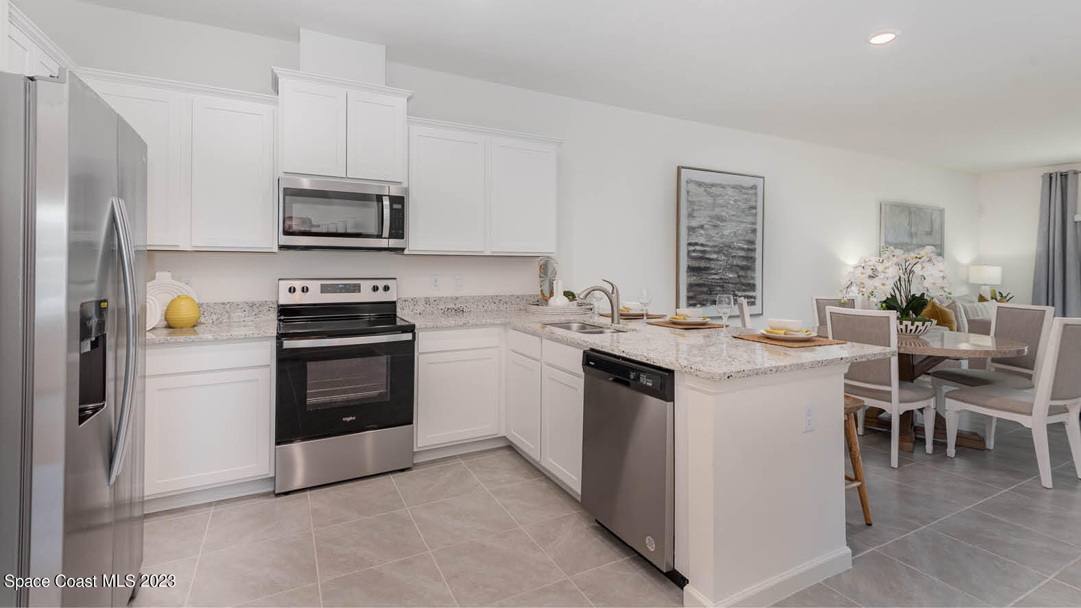 3336 Morrow Place Mims, FL 32754 - Photo 10 of 36 a kitchen with a sink stove and refrigerator