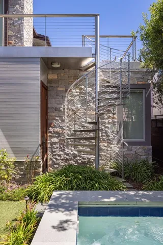 a view of a brick house with a street
