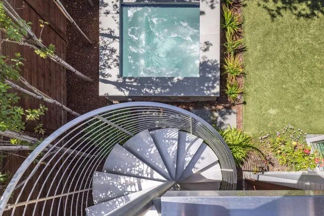 a view of swimming pool from a balcony