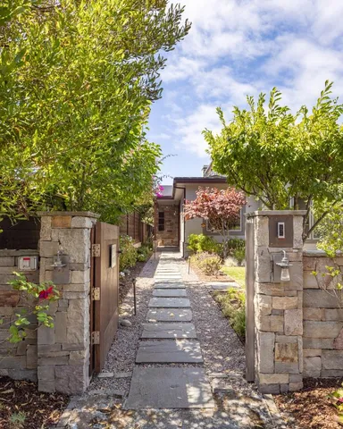 a view of a patio with table and chairs and potted plants
