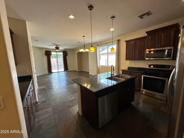 a view of a hallway with wooden floor and a hallway