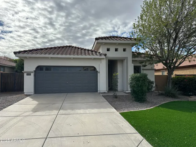 a front view of a house with yard