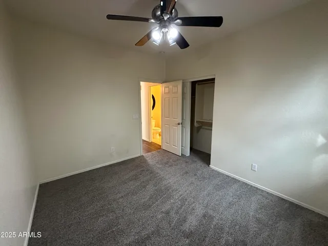 a spacious bathroom with a double vanity sink and a mirror