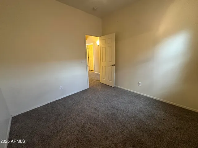 an empty room with a empty space and a window