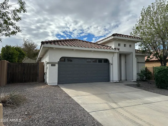 a front view of a house with a garage