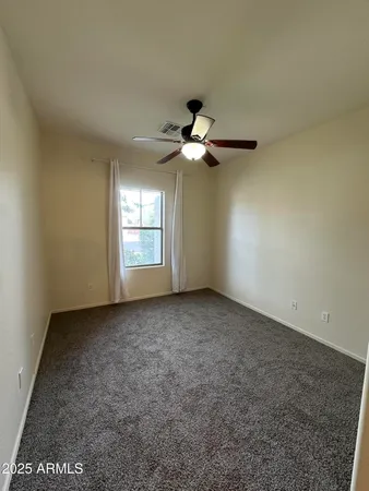 a view of a big room with carpet