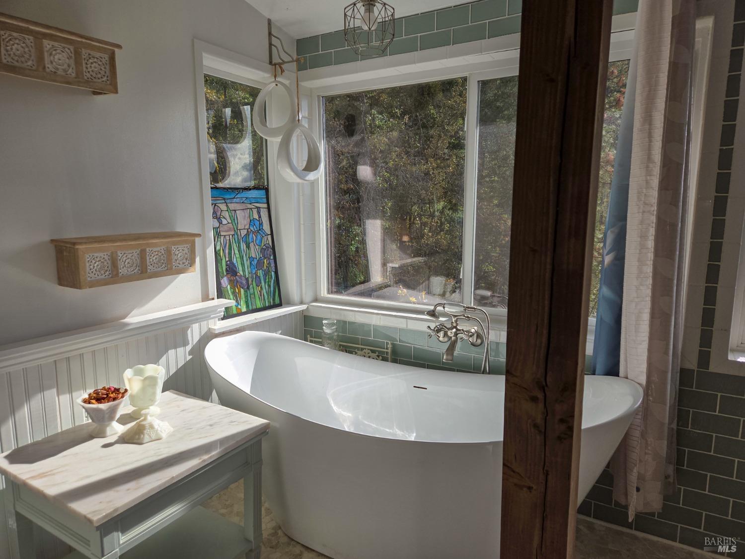 47111 Fox Rock Road Laytonville, CA 95454 - Photo 29 of 44 a bathroom with a tub sink and mirror