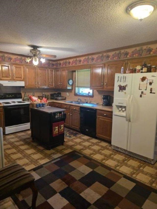 2902 Arp Central Road Ripley, TN 38063 - Photo 13 of 14 a kitchen with stainless steel appliances granite countertop a sink stove and refrigerator