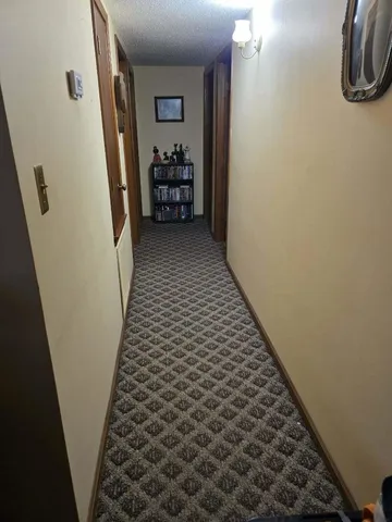 a bedroom with a bed and a television