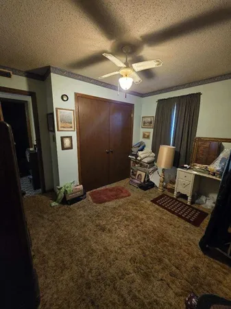 a bathroom with a sink a toilet a mirror and shower