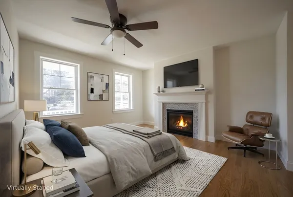 a bedroom with a bed and a fireplace