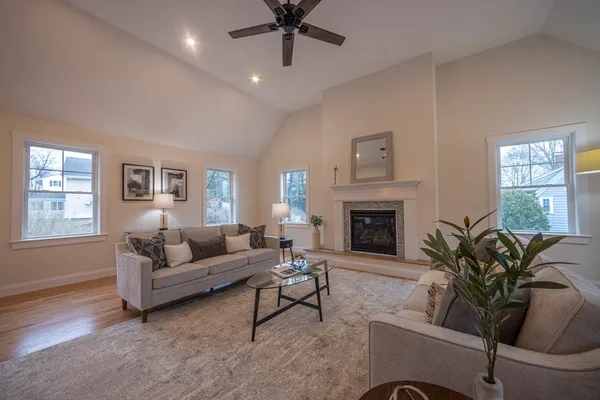 a living room with furniture and a fireplace