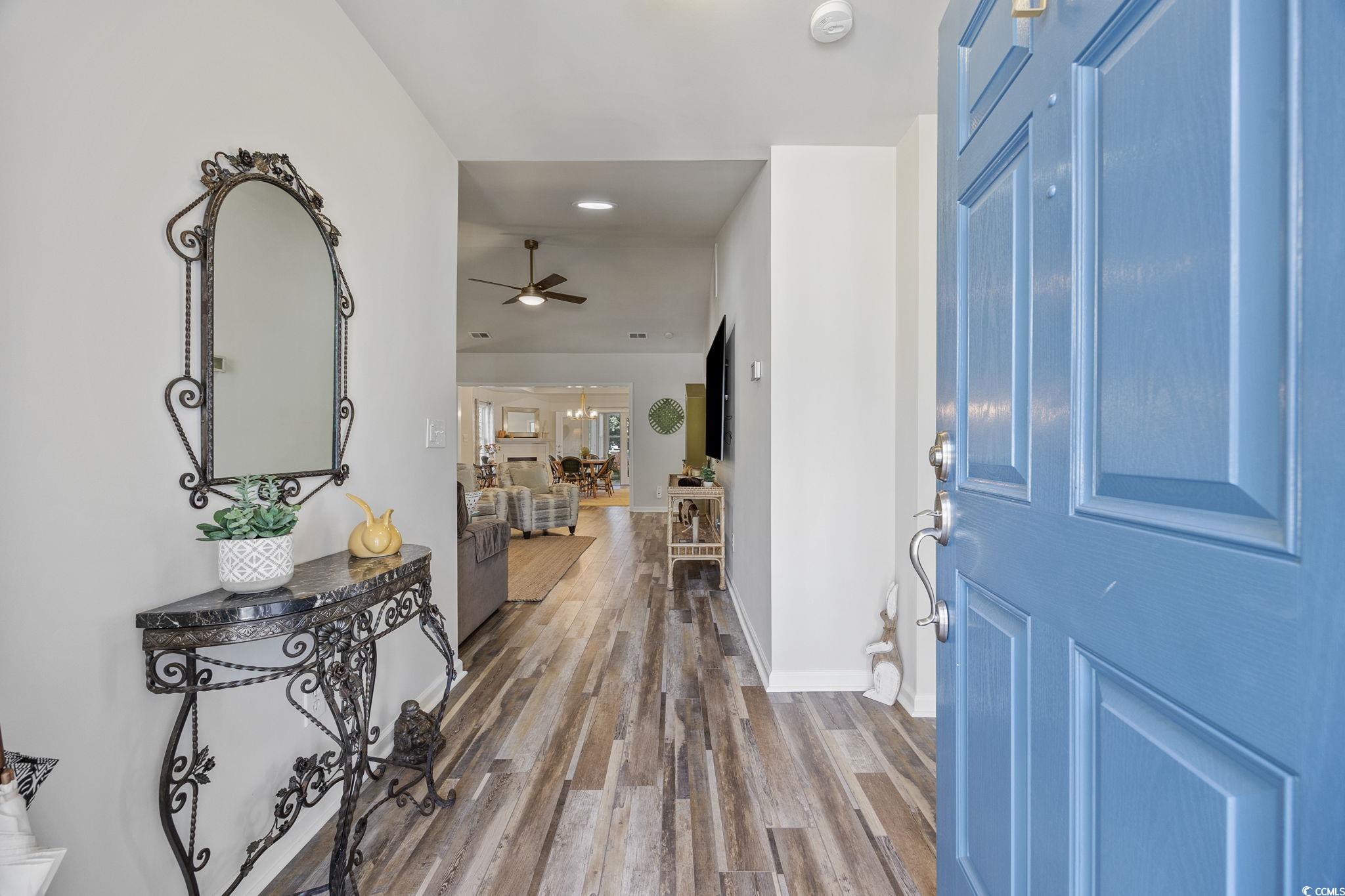 Foyer featuring wood finished floors, ceiling fan, and recessed lighting
