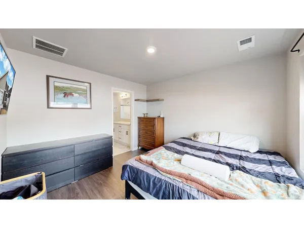 a bedroom with a bed and furniture