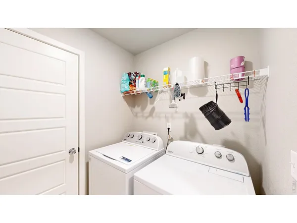a utility room with washer and dryer