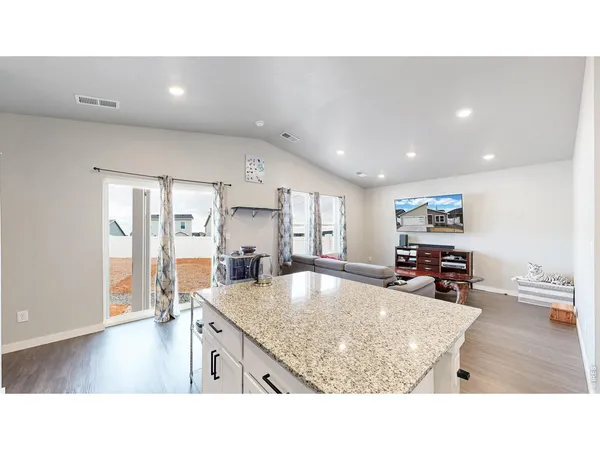 a kitchen with a table and chairs