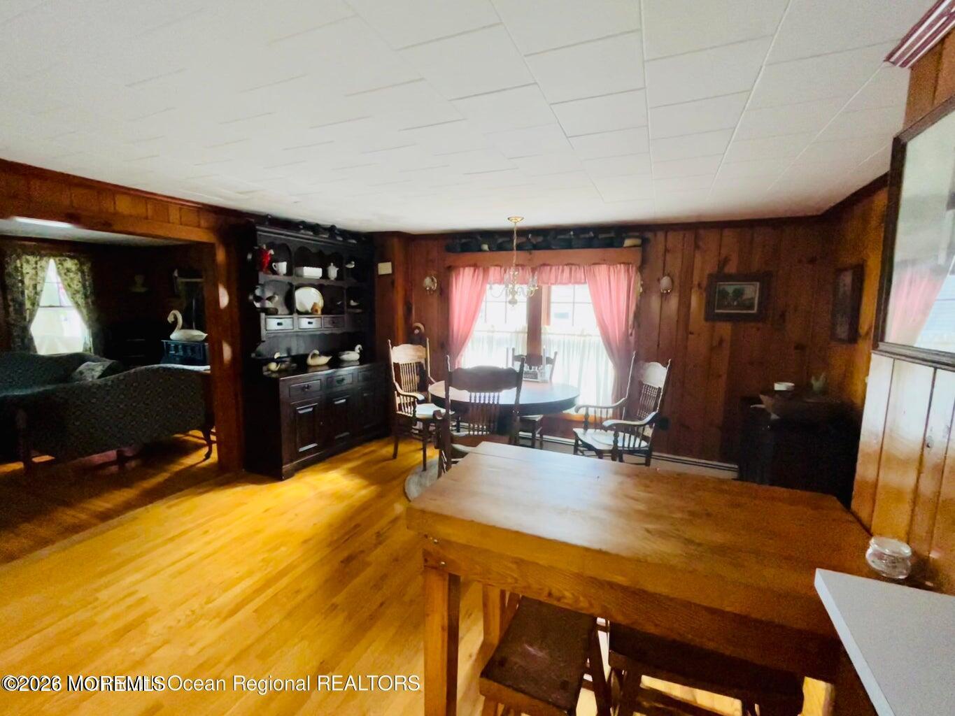 214 Howe Street Point Pleasant, NJ 08742 - Photo 6 of 16 a view of a dining room with furniture and a flat screen tv