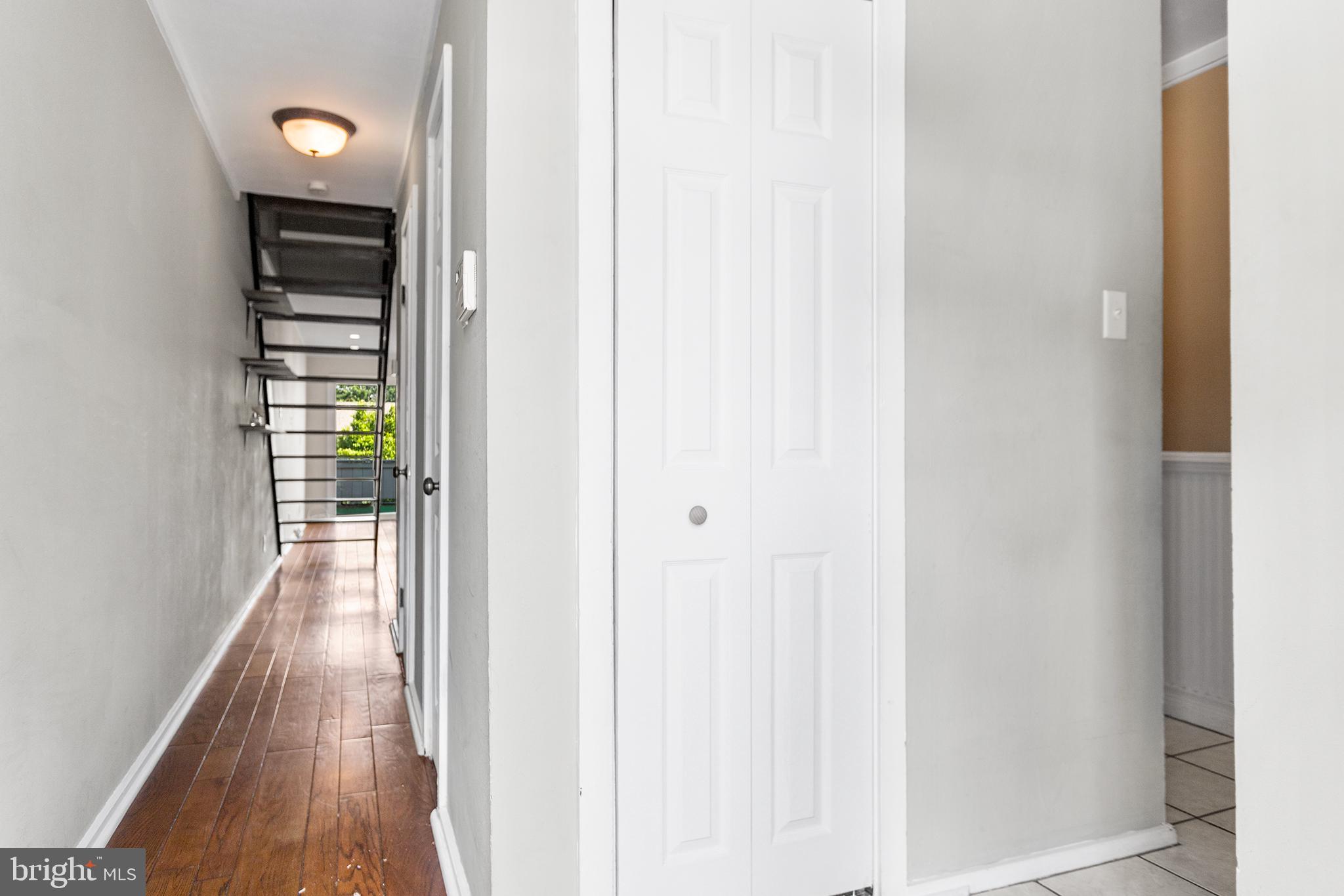 625 Summit House West Chester, PA 19382 - Photo 3 of 16 a view of a hallway with wooden floor