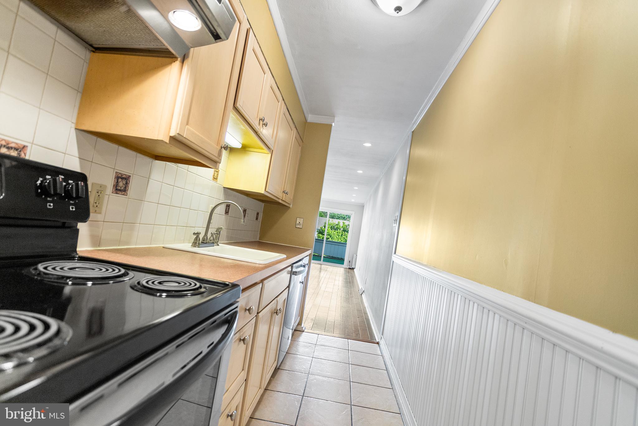 625 Summit House West Chester, PA 19382 - Photo 4 of 16 a kitchen with a stove and a sink