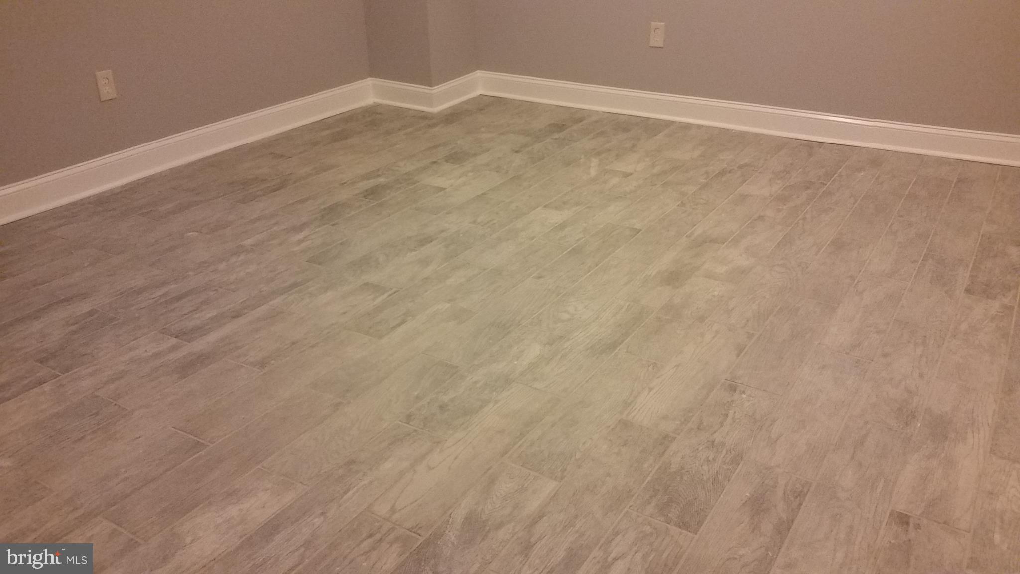 4215 Flowerton Road Baltimore, MD 21229 - Photo 22 of 26 Rustic Tiled Basement Flooring