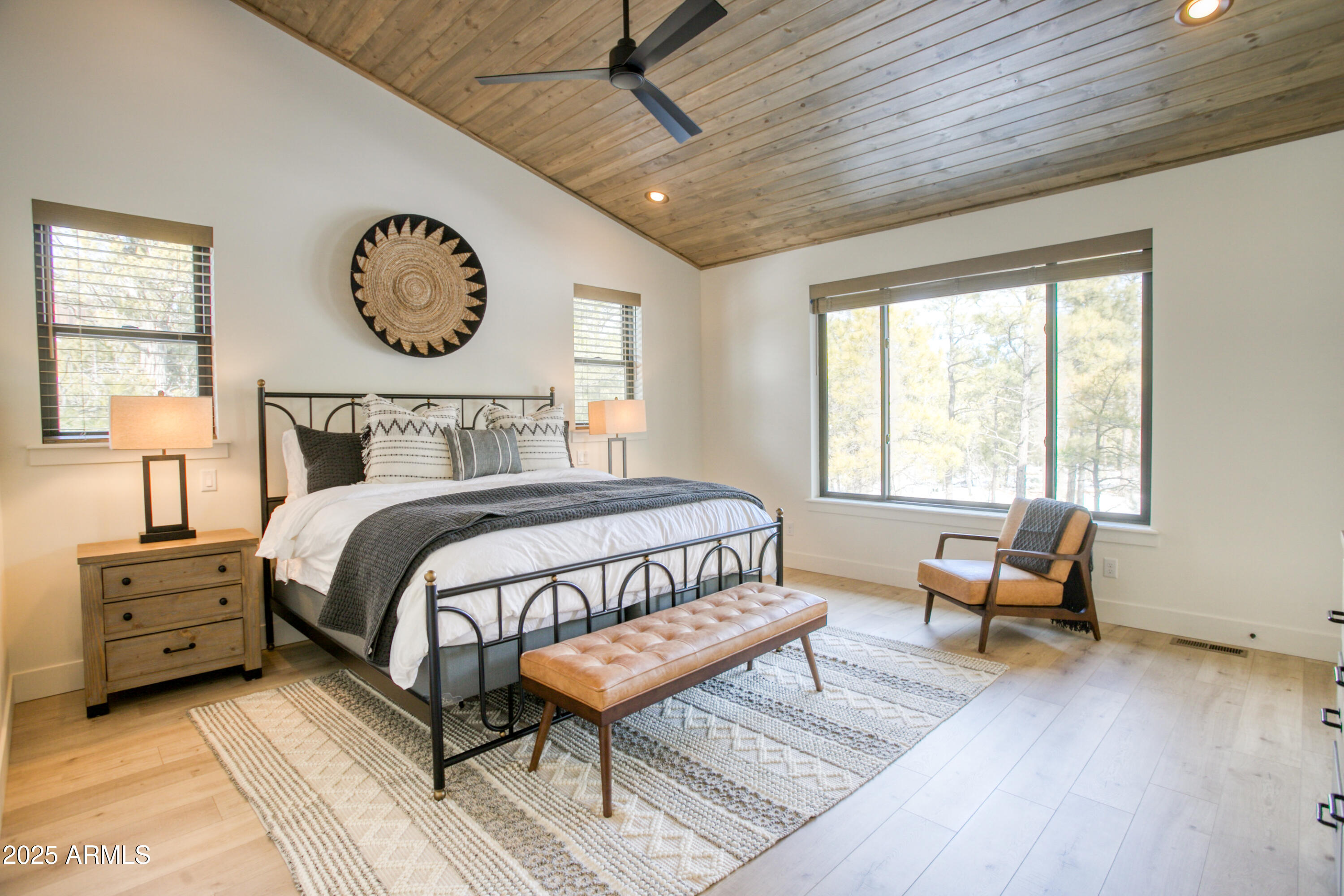 4500 West Hackberry Lane, Unit 161 Show Low, AZ 85901 - Photo 15 of 33 a bedroom with a bed and a large window