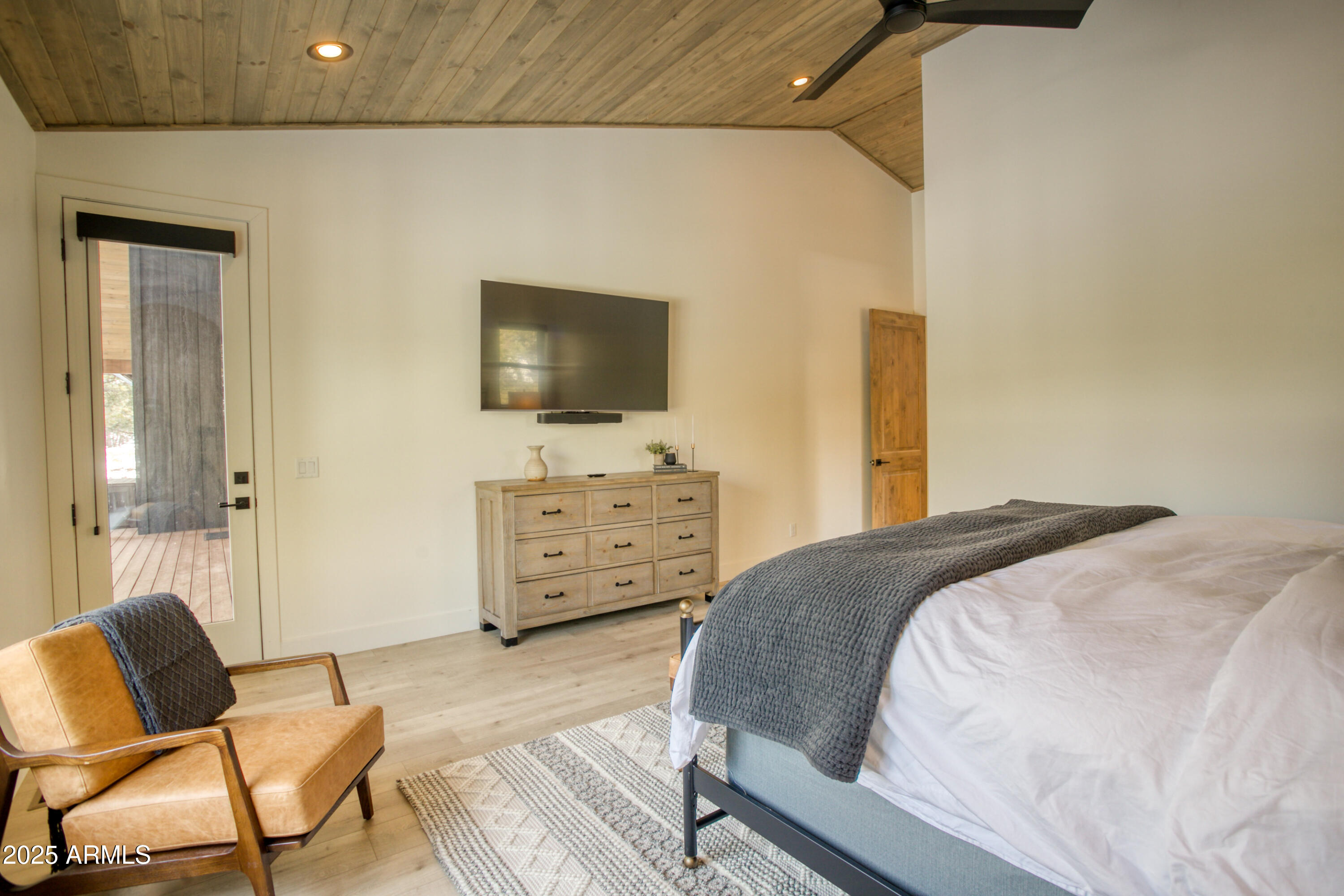 4500 West Hackberry Lane, Unit 161 Show Low, AZ 85901 - Photo 16 of 33 a bedroom with a bed and chair