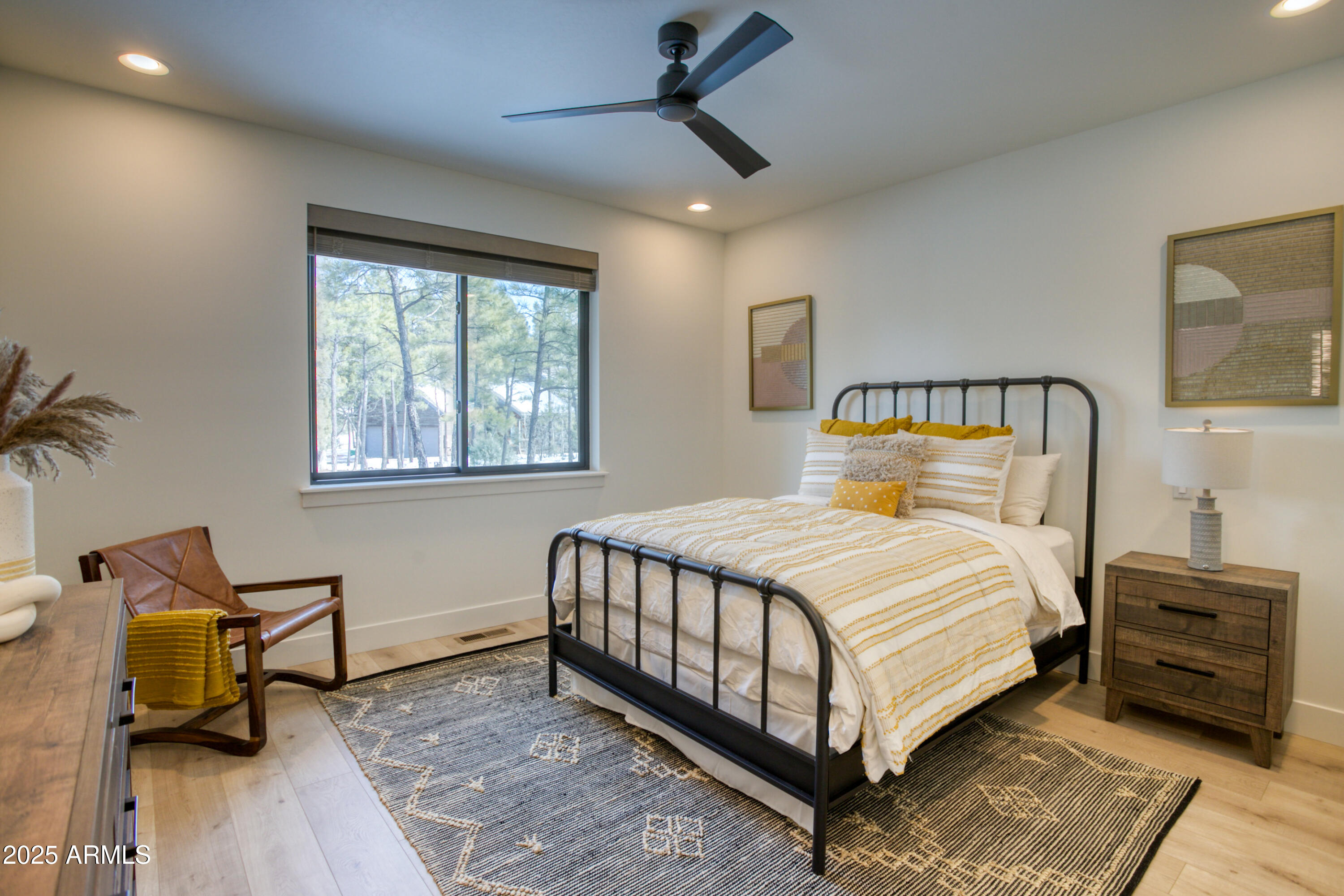 4500 West Hackberry Lane, Unit 161 Show Low, AZ 85901 - Photo 24 of 33 a bedroom with a bed a mirror and a window