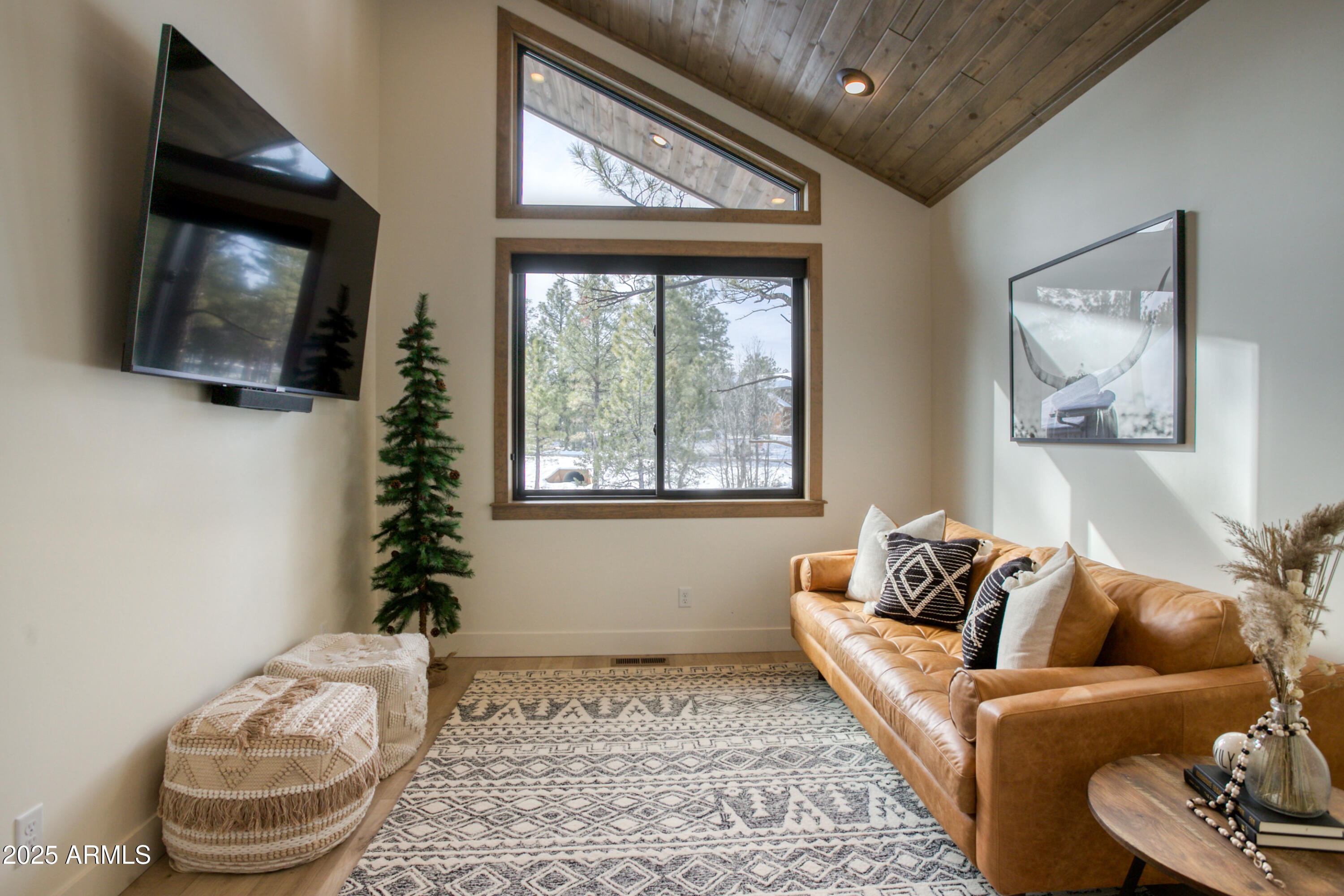 4500 West Hackberry Lane, Unit 161 Show Low, AZ 85901 - Photo 26 of 33 a living room with furniture and a flat screen tv