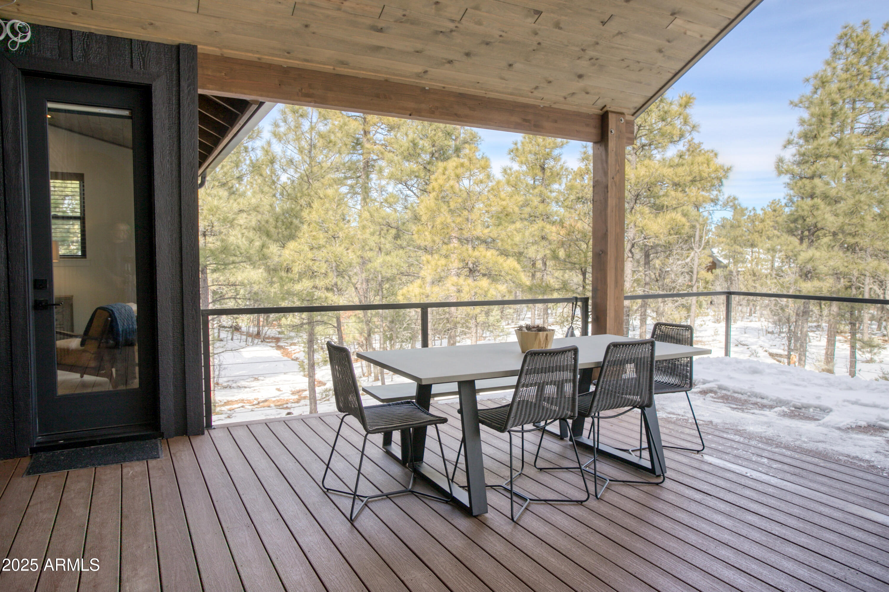 4500 West Hackberry Lane, Unit 161 Show Low, AZ 85901 - Photo 28 of 33 a view of a deck with wooden floor and outdoor seating